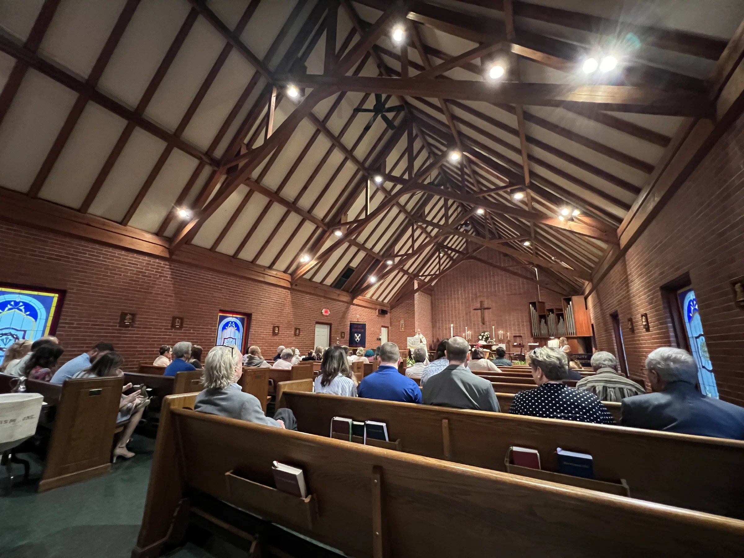 Parishioners gathered for worship in the timber-vaulted nave of St. Andrew's