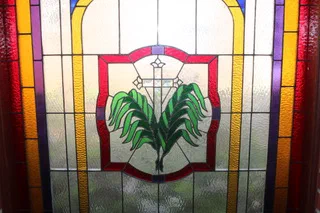 Stained glass window with a crown of thorns motif